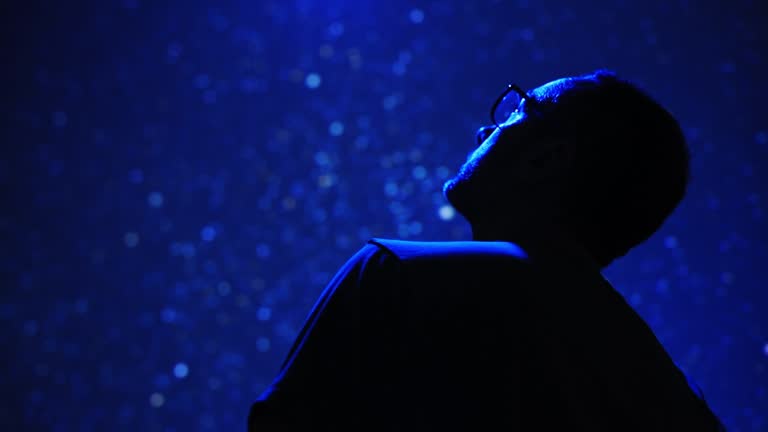 man looking up at the sky